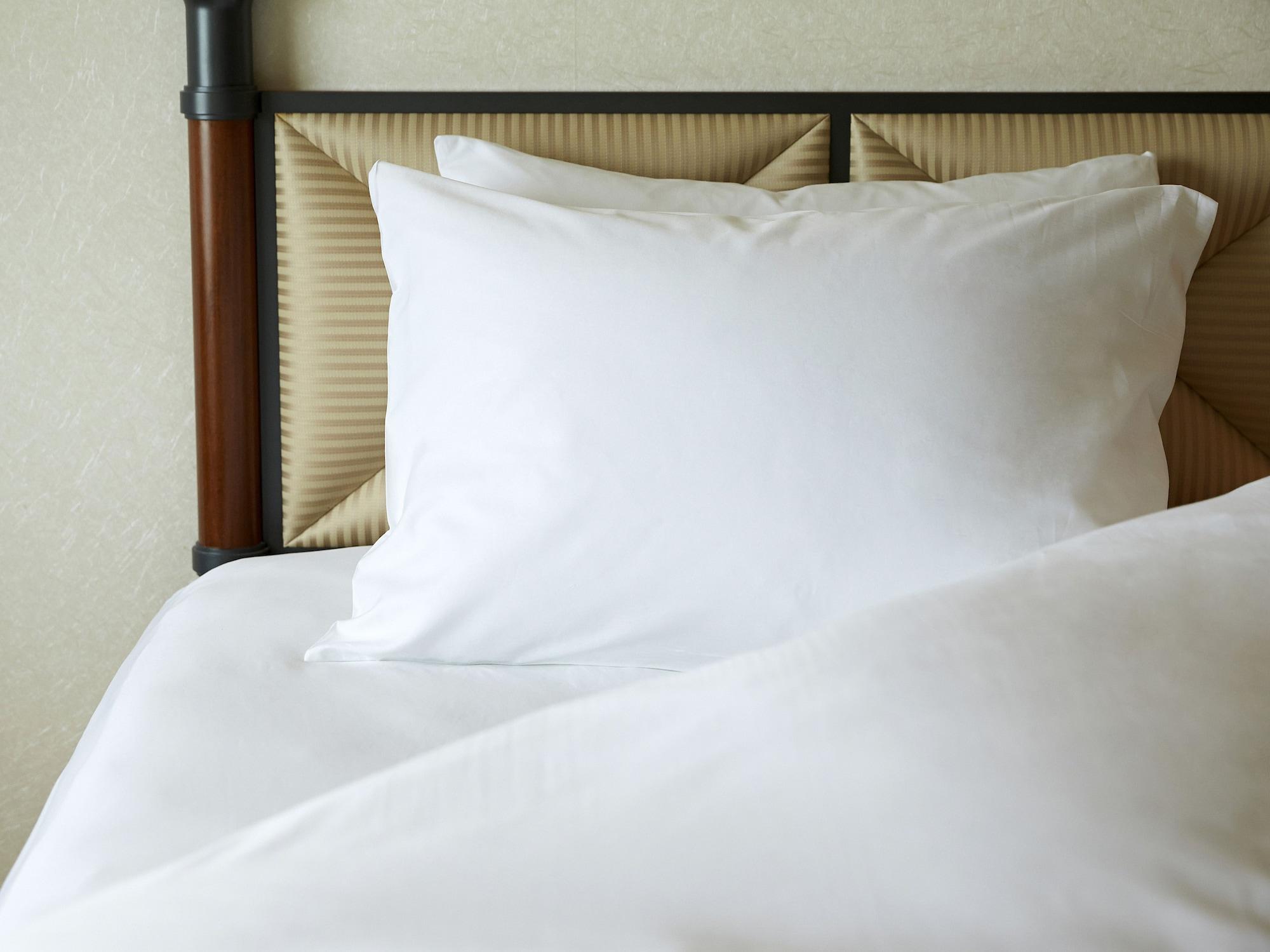 Miyako Hotel Gifu Nagaragawa Kültér fotó A pillow on a bed